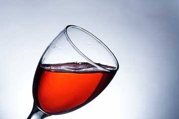 image pouring red wine into a glass