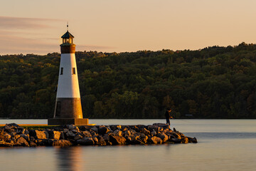 Sunset photo of the Myers Point Lighthouse at Myers Park in Lansing NY, Tompkins County. The lighthouse is situated on the shore of Cayuga Lake, near Ithaca New York.