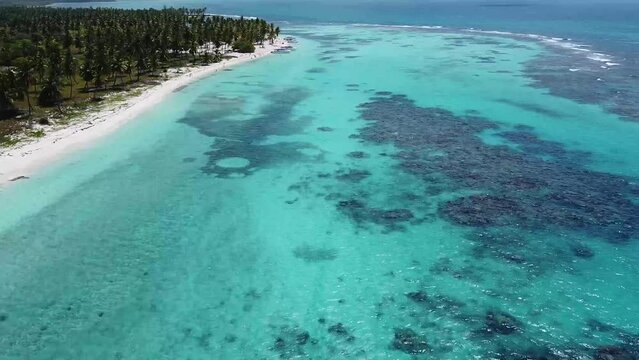 Amazing aerial drone image of the sea, beach and nature of the beautiful waters of Punta Cana, Dominican Republic.