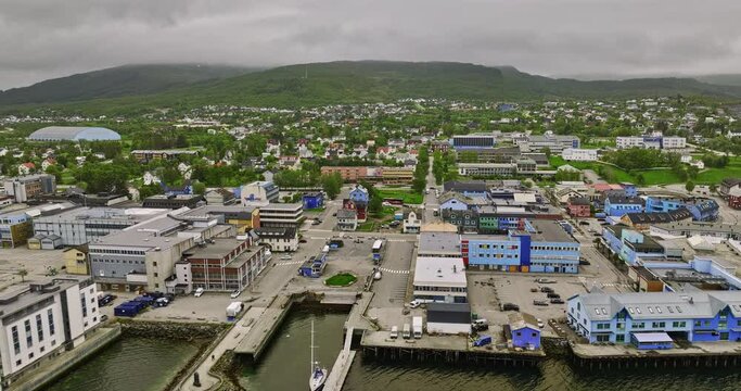 Sortland Norway v2 cinematic low level flyover artistic blue town, capturing local center neighborhood and sortlandsbrua bridge crossing sortlandsundet strait - Shot with Mavic 3 Cine - June 2022