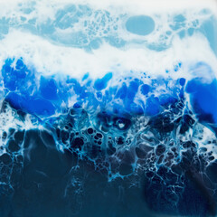 Fototapeta na wymiar Resin art composition with blue tones. Epoxy background