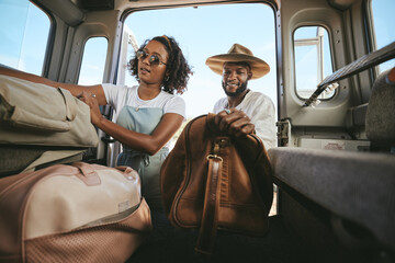 Black couple, travel and packing for road trip, journey or adventure with bags together. Happy...