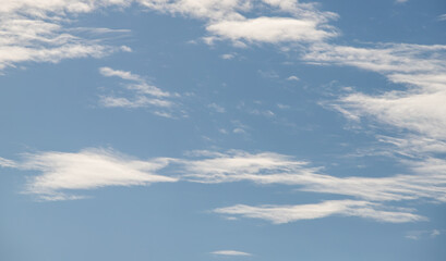 Naklejka na ściany i meble Blue sky with white clouds. Sky background.