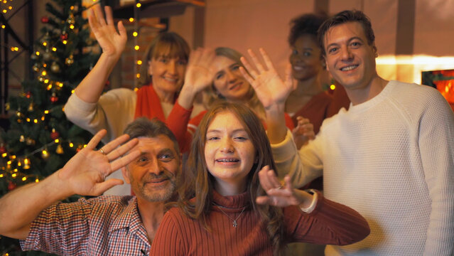 A group of multi ethnic. Portrait of Caucasian and African American black woman have a celebration in video call conference party on Merry Christmas Eve Xmas on holiday at home. People lifestyle.