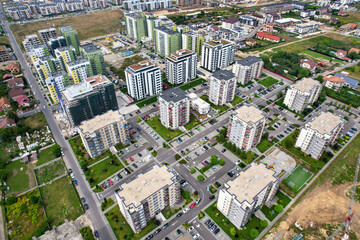Aerial view of a large urban construction site with apartment blocks in a residential area. Brașov, Romania