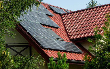 Historic farm house with modern solar panels on roof and wall High quality photo