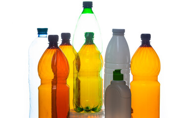 Various Empty Colorful Plastic Recycle Garbage Bottles and Cans In Line Together Over White Background.