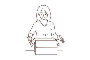 Smiling woman unpack box with order