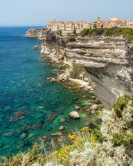 The city of Bonifacio perched on its scenographic cliffs on a sunny summer day. Southern Corse,...