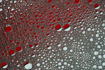 Abstract texture background in red. Circles of oil in soapy water.