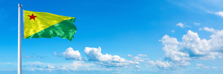 Acre - state of Brazil, flag waving on a blue sky in beautiful clouds - Horizontal banner