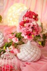 Holiday decoration decor. A vase with flowers. The wedding ceremony.