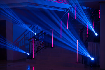Neon Background. Dark blue and red neon stairs at the night. Night club, bar, concert or studio...