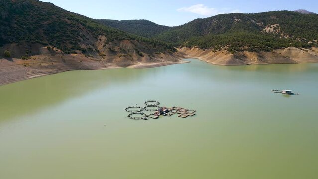 Aerial view of fish farm in Antalya Korkuteli dam lake on a sunny day