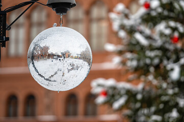 streets decorated with mirror balls or disco balls for a Christmas event, closeup