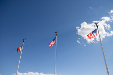 Low angle view of American flags on pole