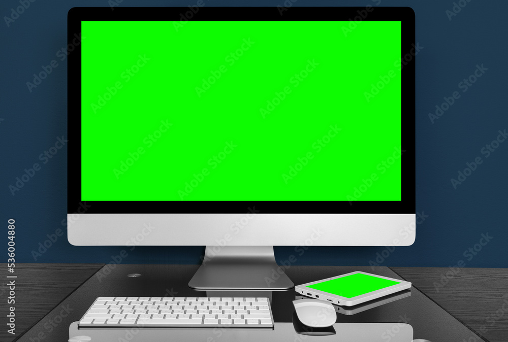 Poster modern computer on the table on the blue background. green screen display
