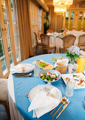 Banquet in the restaurant, serving tables, appetizers, sets