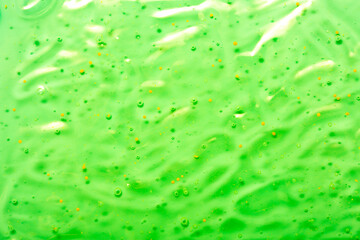 Cosmetic gel close-up with oxygen bubbles. Textured background with microbrushes in cosmetics. Moisturizing skin serum with vitamins and collagen.