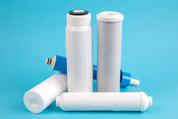 filter cartridges for water on a bright blue background.