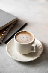 Coffee cup with milk in white ceramic cup. Lifestyle morning drink photo