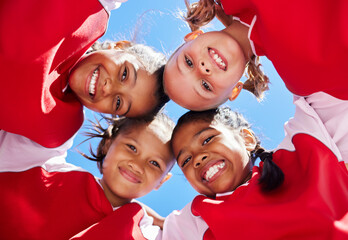 Huddle, motivation and girl team in soccer planning a fitness strategy with teamwork on sports football field. Low angle, brazil and happy friends having fun and enjoy group support in global match