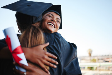 Students, graduation and happy together for hug to celebrate at college. Women, friends and...