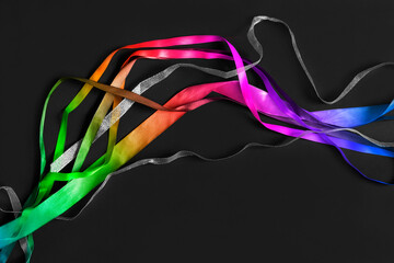 Obraz na płótnie Canvas Colorful ribbons on black