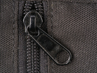 Black metal zipper closure. Extremely close