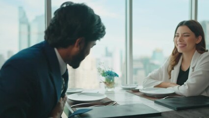Happy business couple meet up shake hands and talking in restaurant at rooftop 