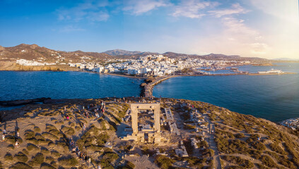 Aerial view of the famous Portara Gate at Naxos island, Cyclades, Greece, with the town behind...