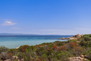 Fototapeta na wymiar Karydi beach on Vourvourou bay in Sithonia, the central peninsula of Halkidiki surrоundеd by rοскs of intеrеsting shаpеs and covered with stunted endemic vegetation, Greece