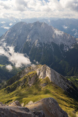 Fototapeta na wymiar Predigtstein peak at sunrise in the clouds in the Gaistal valley. Austria alps in Tyrol