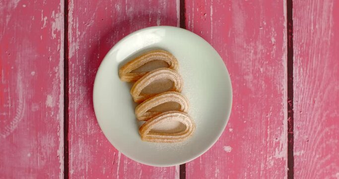 Flat lay food stop motion: churos appears on the plate