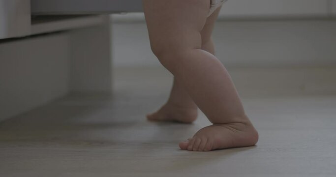 Handheld shot of shaky unstable baby feet