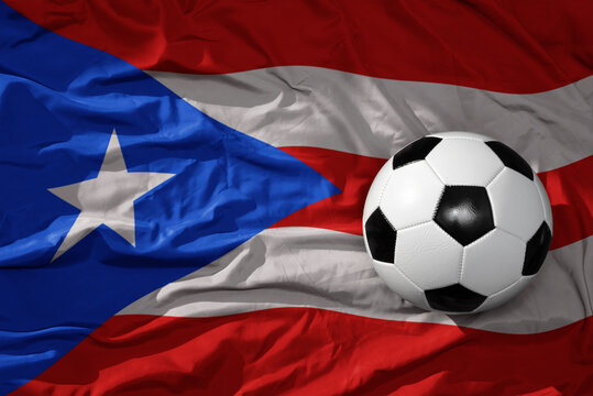 vintage football ball on the waveing national flag of puerto rico background. 3D illustration