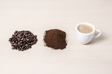 Two coffee cups or mugs with beans and ground coffee on wooden desk or table, I like, love coffee,...