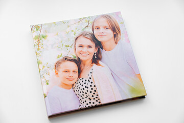 book cover of a photobook from a photo shoot of a family. mother and sons.