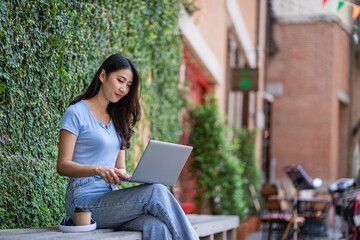beautiful asian woman Working in a coffee shop on a laptop online work concept