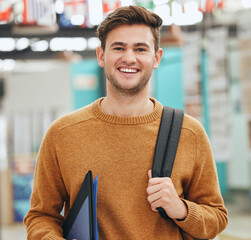 College, study and education student man portrait with back to school backpack and portfolio in a classroom or university campus. Learning person with motivation, goal and knowledge for a scholarship