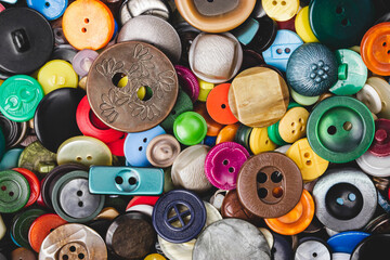 Sew-on buttons close-up. Needlework - background. Various sew-on buttons.