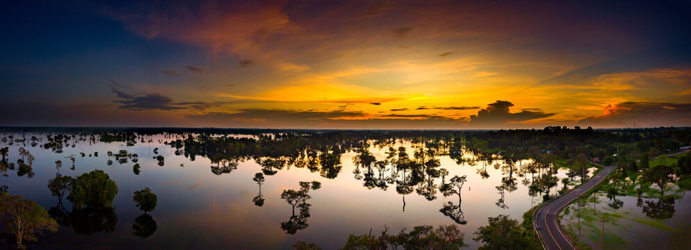 Panorama Top view photo flying drone twilight Beauty Evening colorful clouds - sunlight with dramatic sky.Dramatic sunset with blue sky reflection in water,Thailand,asia.