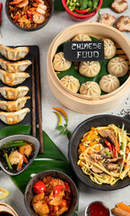 Assorted Chinese food on dark background. Asian food concept. Top view.
