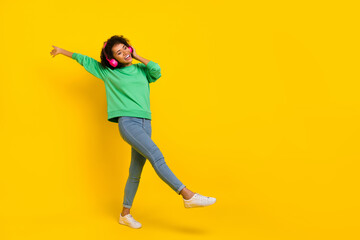 Fototapeta na wymiar Full body photo of peaceful chilling girl enjoy listen favorite song isolated on yellow color background