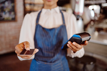 Hand, customer payment using credit card, machine or 5g technology. Manager, sales or money...
