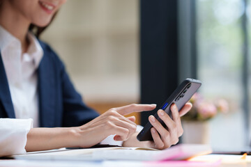 Fototapeta premium A businesswoman completes KYC using an online banking program in order to open a digital savings account. The definition of cyber security
