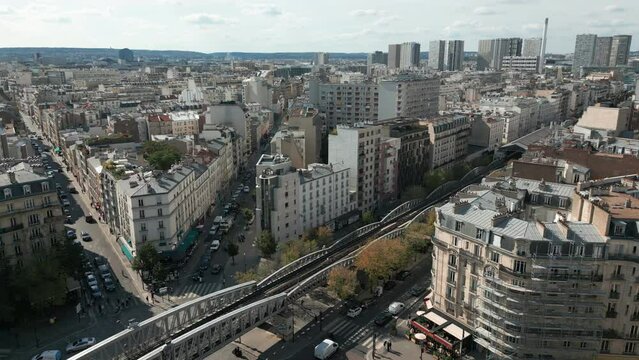  Aerial circling over metro bridge in Cambronne square and surrounding cityscape, Paris 