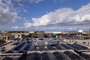 Solar panels on new NOM apartment complex rooftop in Noorderhaven neighbourhood seen from above....