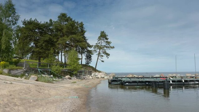The landscape view of the port in Kasmu Estonia with the small ledge for the boat to dock on the shore