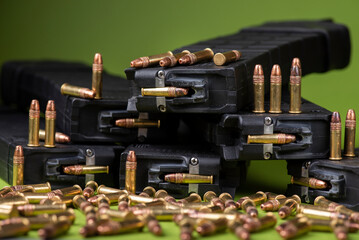 Equipped 22lr magazines and individual rimfire rounds side by side.
